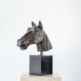 Contemporary horse head statue crafted in resin with a solid marble base, modern decor piece.